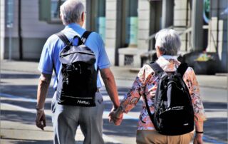 older couple holding hands